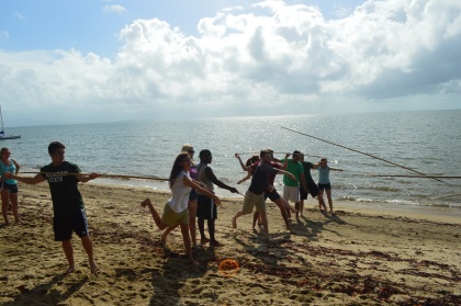A group practicing spear throwing